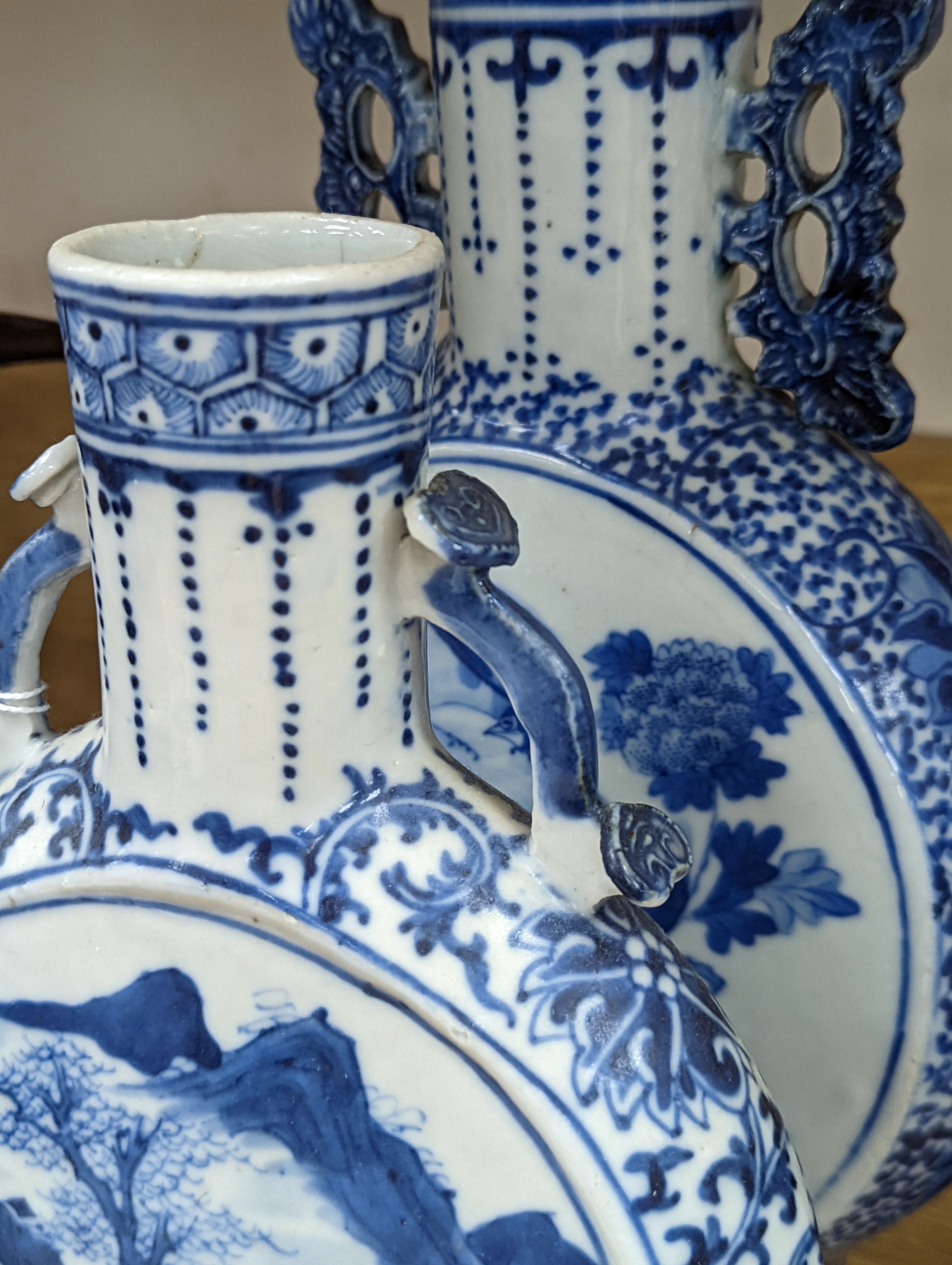 Three 19th century Chinese blue and white Moon flasks, tallest 31 cms.